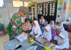 Babinsa Koramil Camplong Dampingi Program Makan Bergizi Gratis di SDN Madupat 3